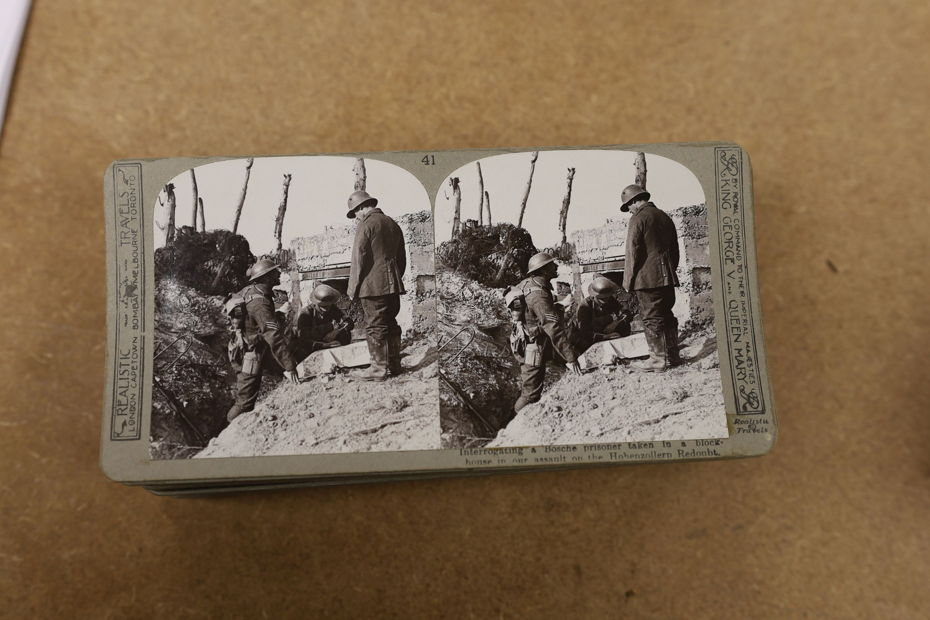 A set of The Great War stereoscopic slides, in case, and a viewer, 31 cms long.